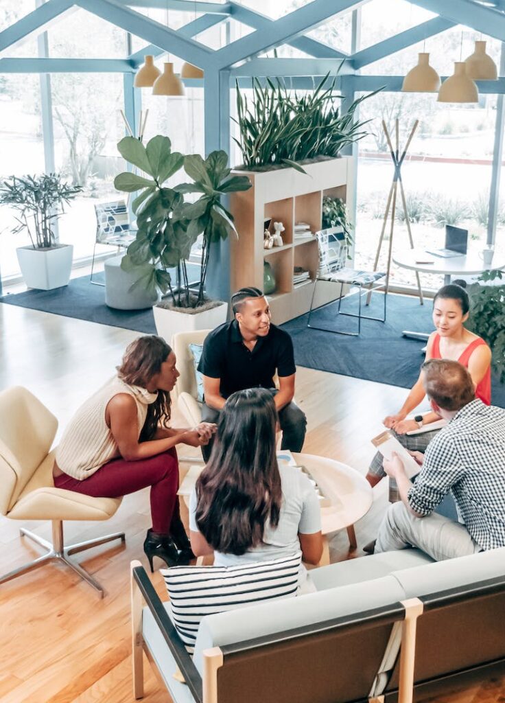 team meeting in lounge of coworking space