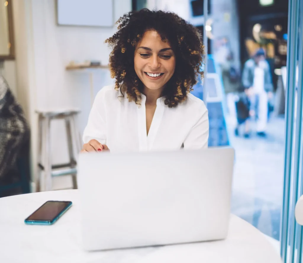 depositphotos 576861028 stock photo cheerful female programmer working remotely e1705310150390