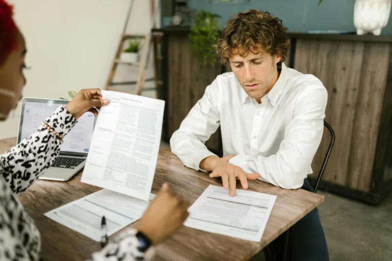 Man at his table filing Form 1099-DIV.